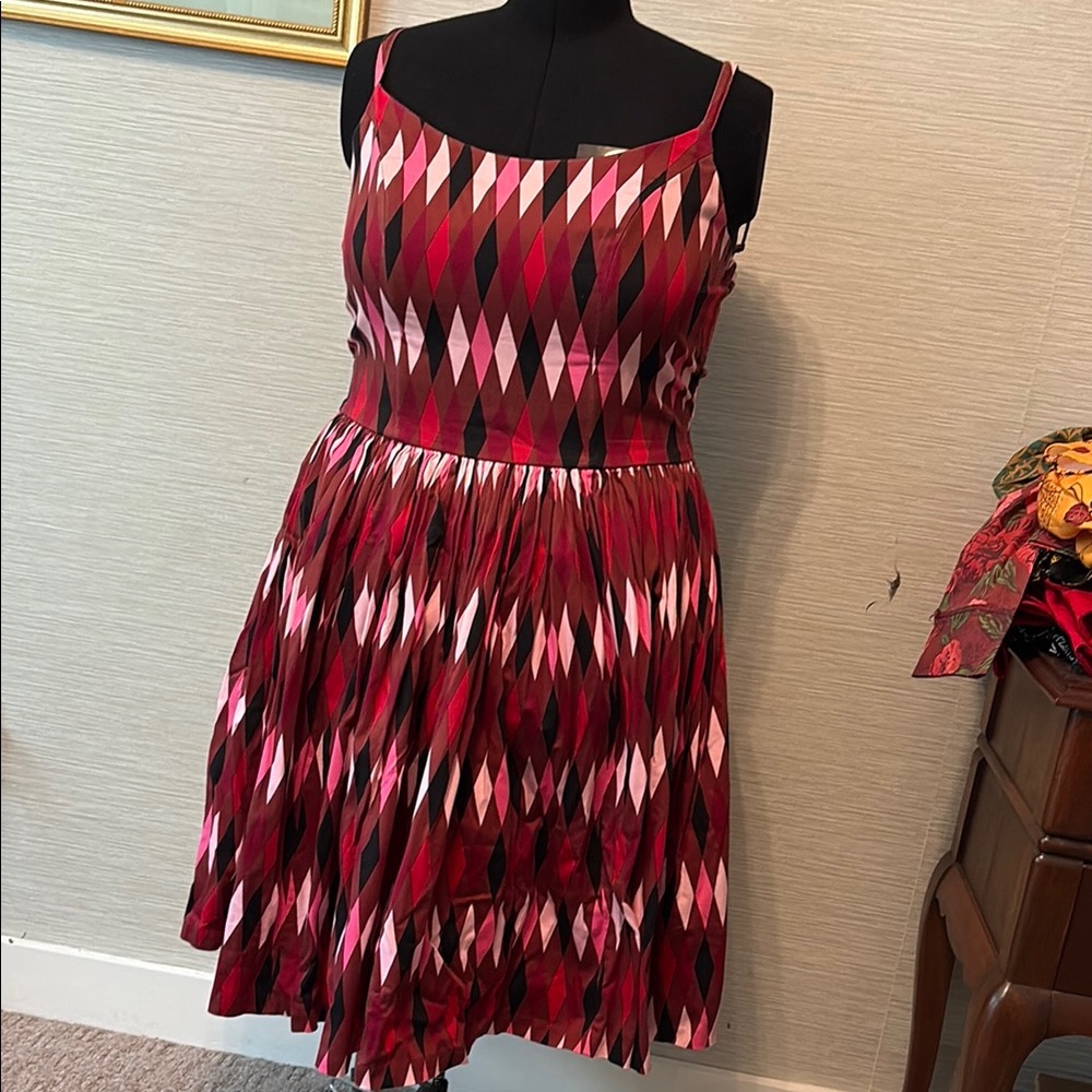 PUG Jenny dress in red and chocolate harlequin